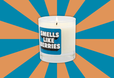 smells like berries blue label candle orange and blue background