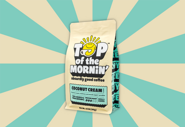 top of the mornin' coconut cream coffee tan bag with blue badge side tan and blue background