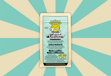 top of the mornin' coconut cream coffee tan bag with blue badge back of bag tan and blue background