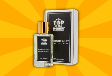 Perfume bottle and packaging of 'Top of the Mornin'' on a yellow background