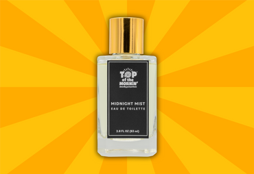 Perfume bottle labeled 'Top of the Morning' on a yellow sunburst background