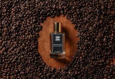Perfume bottle on a bed of coffee beans