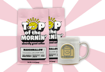 two marshmallow bags of flavored coffee with a fluffin delicious white mug pink background