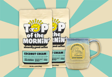 Top of the mornin coconut cream two bags and one mug cream and blue background