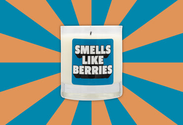 smells like berries blue label candle orange and blue background