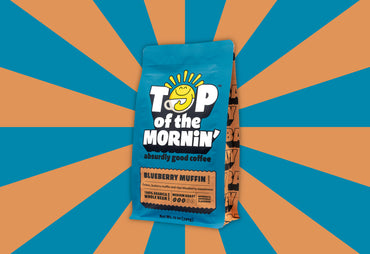 blueberry muffin coffee top of the mornin side of bag blue and orange background