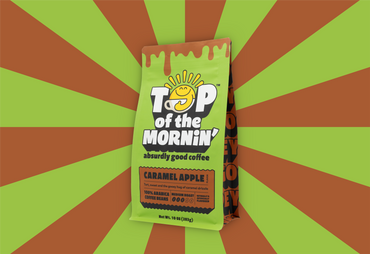 green top of the mornin' coffee bag with orange badge caramel apple flavor front of bag orange and green rays in the background