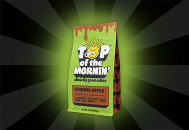 Coffee bag labeled 'Top of the Mornin'' with a caramel apple flavor on a dark background