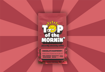 pink and red stripped background top of the mornin coffee absurdly smoochy coffee chocolate raspberry flavored coffee red and pink bag - front of bag