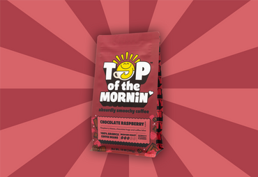 pink and red stripped background top of the mornin coffee absurdly smoochy coffee chocolate raspberry flavored coffee red and pink bag - bag angled