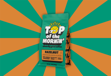 Top of the Mornin' hazelnut coffee package on a green and orange striped background