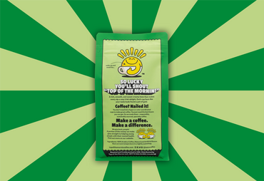 Coffee package with a green and yellow design on a green and yellow striped background