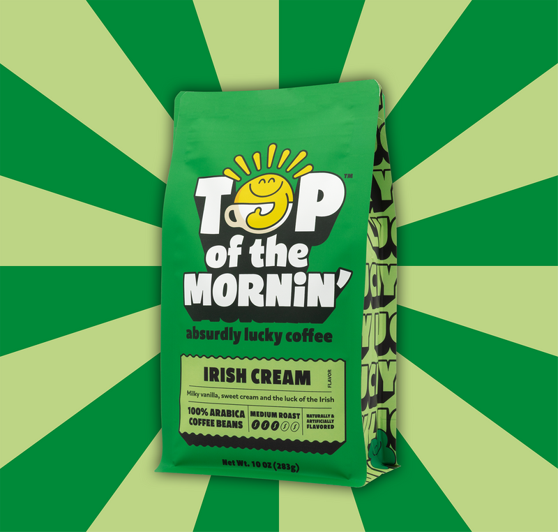 Green coffee bag labeled 'Top of the Mornin'' on a green and yellow striped background