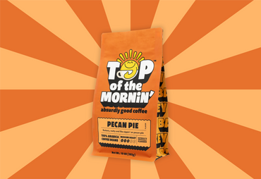 Top of the Mornin' coffee package on an orange and brown striped background