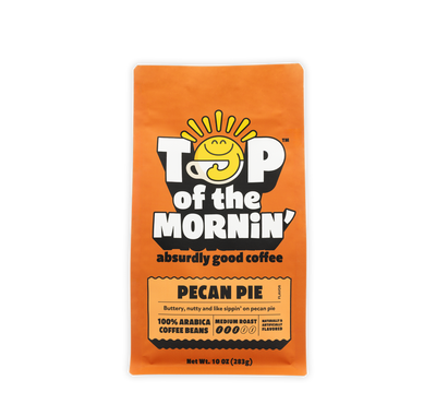 Coffee package labeled 'Top of the Mornin'' with pecan pie flavor on an orange background