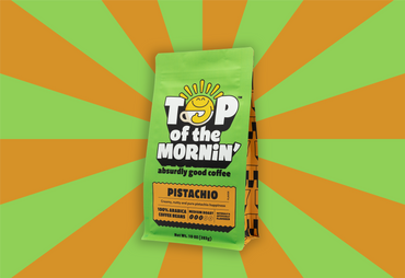 Coffee package with 'Top of the Mornin'' branding on a green and orange striped background