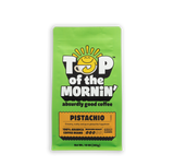 Green package of Top of the Mornin' pistachio coffee on a white background