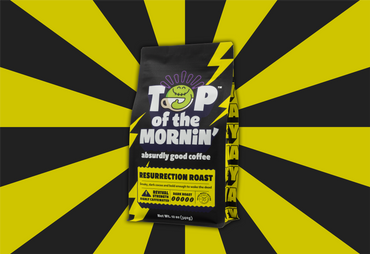 top of the mornin Resurrection roast yellow and black back on top of a yellow and black striped background side view