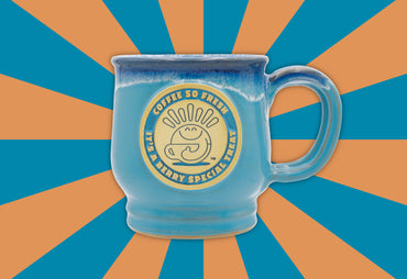 TOTM berry special mug blue mug front of mug blue and orange background